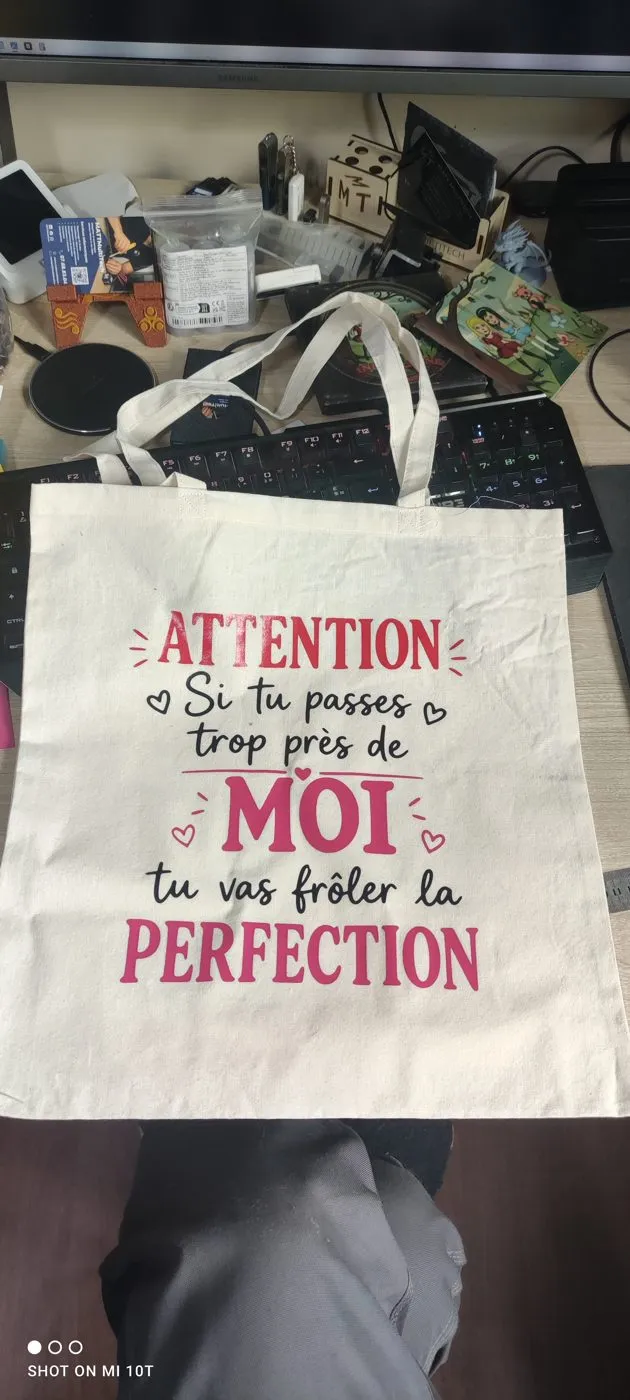 Sac en toile naturelle marqué d’un texte humoristique en deux couleurs